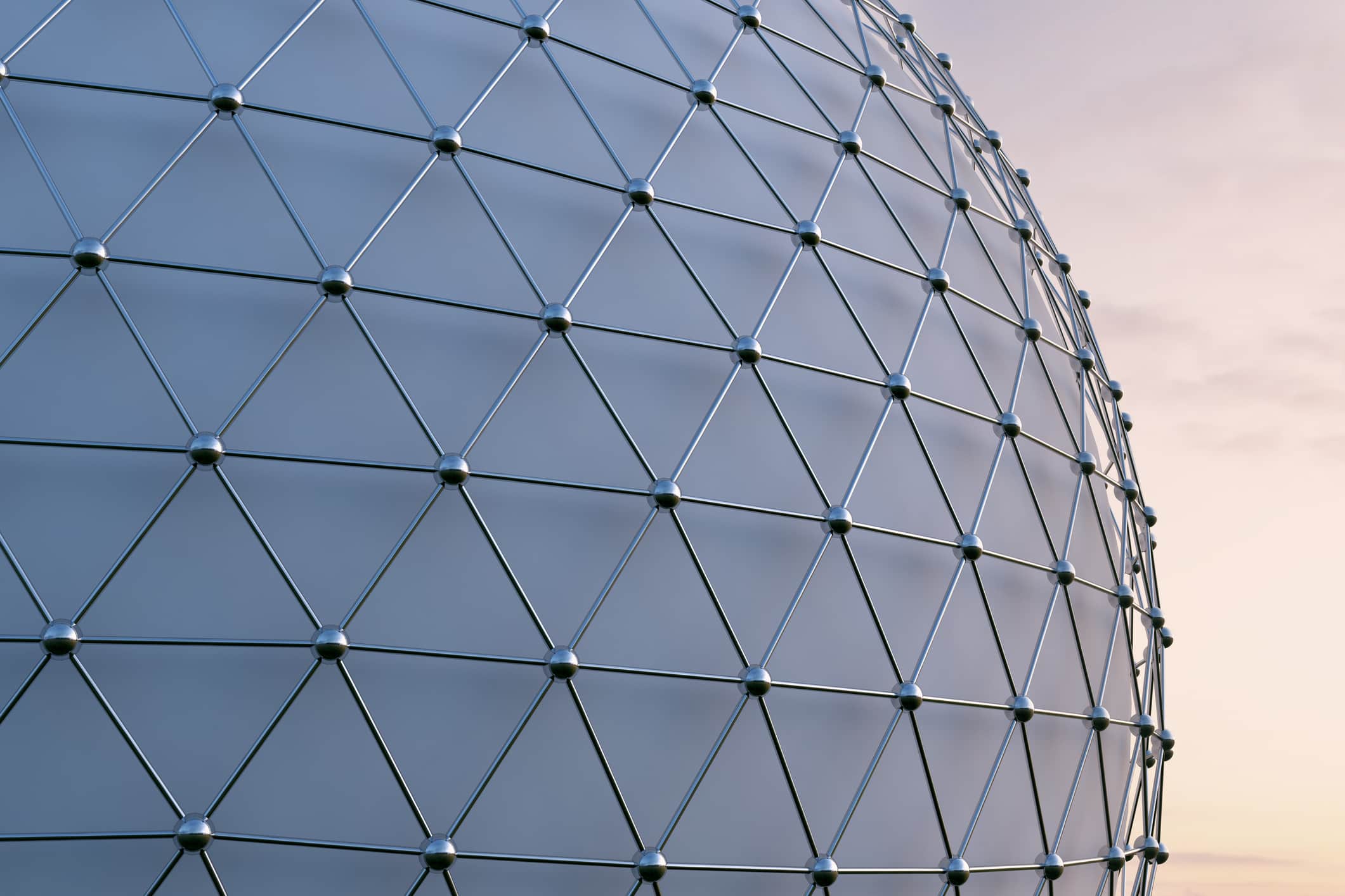 A large spherical structure or building with a metal scaffolding cover.